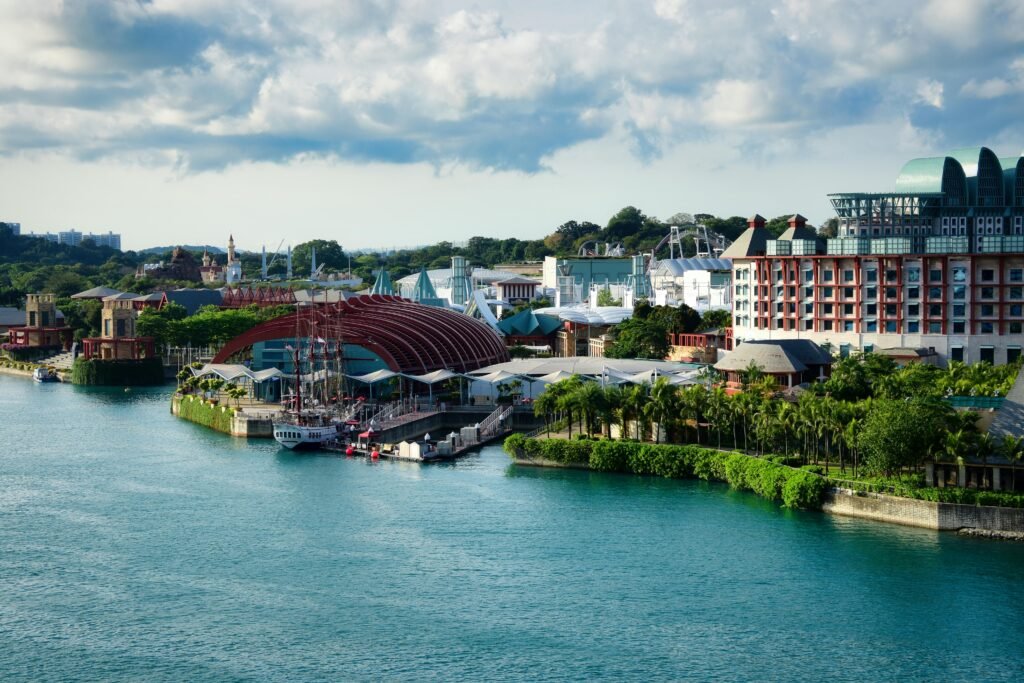 A scenic aerial view of Sentosa Island, Singapore, showcasing architecture and lush greenery.