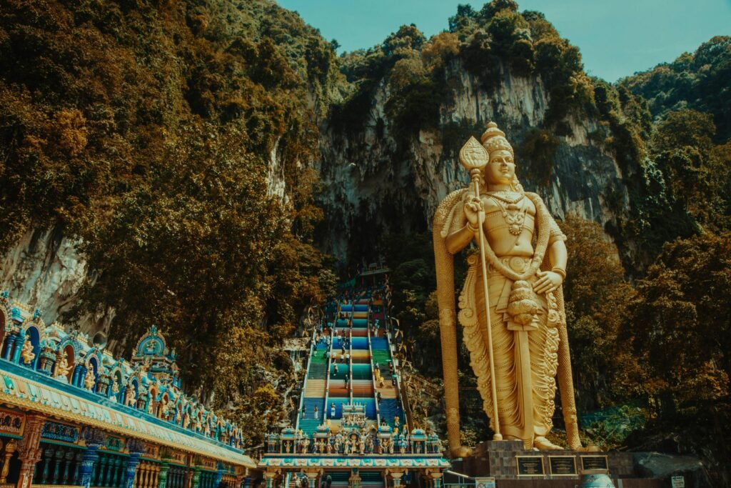 Majestic statue of Lord Murugan at Batu Caves, a famous tourist destination in Malaysia.