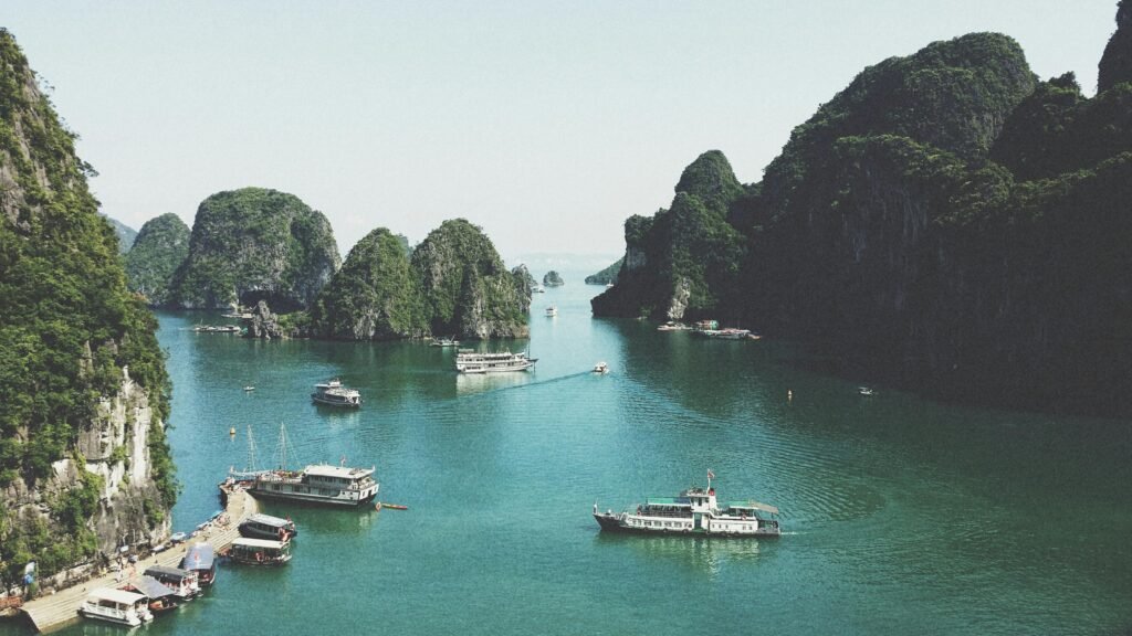 A breathtaking view of Halong Bay with boats navigating through limestone islands.