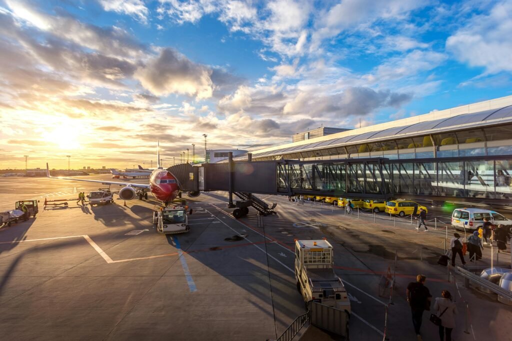 pexels-photo-2026324-2026324 A vibrant sunset at Copenhagen Airport with airplanes and bustling activity.
